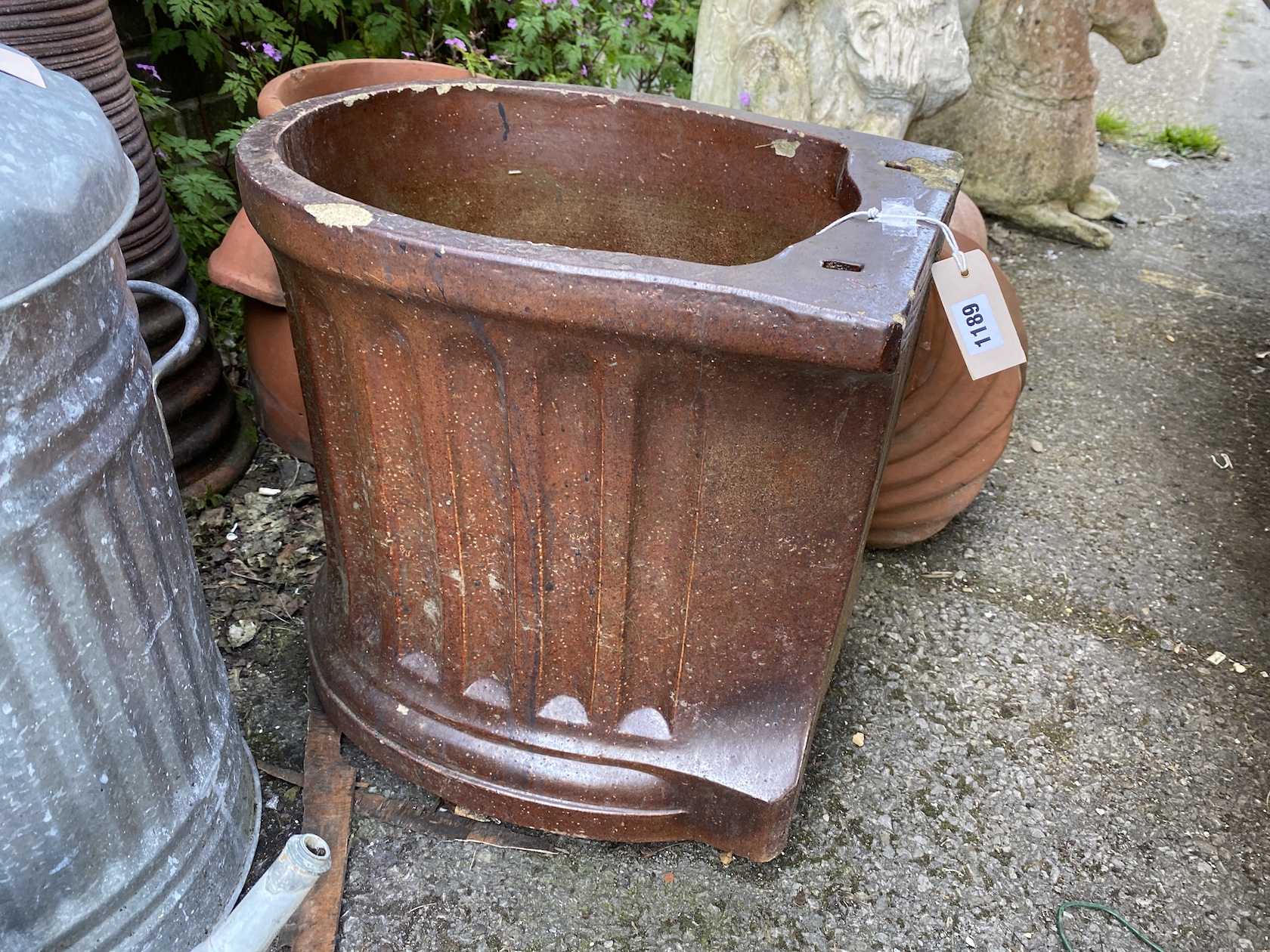 Six assorted terracotta and earthenware planters and ornaments *Please note the sale commences at 9am.